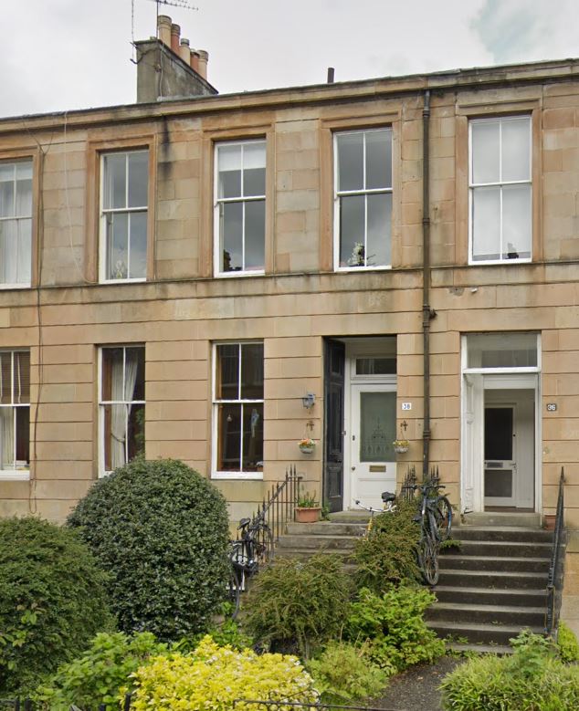 Georgian style mid terrace sandstone frontage