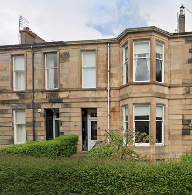 3 storey blond sandstone mid terraced house with Victorian bay windows