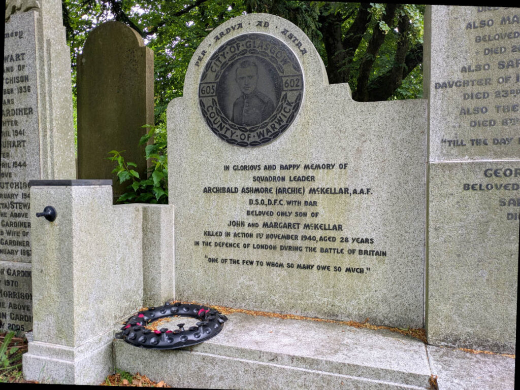 Memorial stone with picture of McKellar, his Squadron details (602 City of Glasgow and 605 City of Warwick) and dedication beneath. "Killed in the defence of London, one of the few to whom so many owe so much"