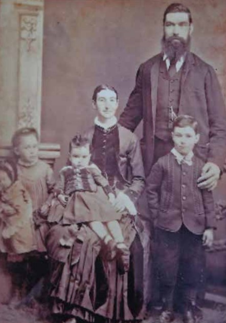 Family portrait of John, his wife and children