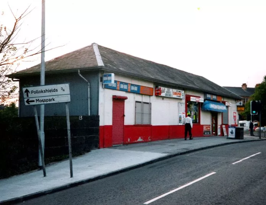 Former station building in red and white paint job as Susie's shop