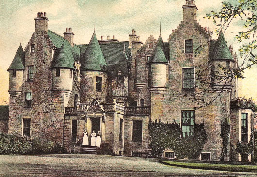 17th C castle with more modern wing on the right, all crow-stepped gables and Scots Baronial turrets; servants pose at the front door