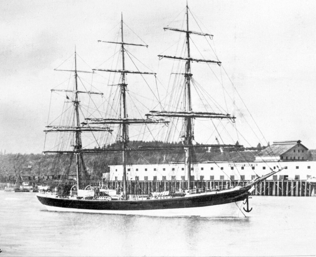 Three masted ship at anchor