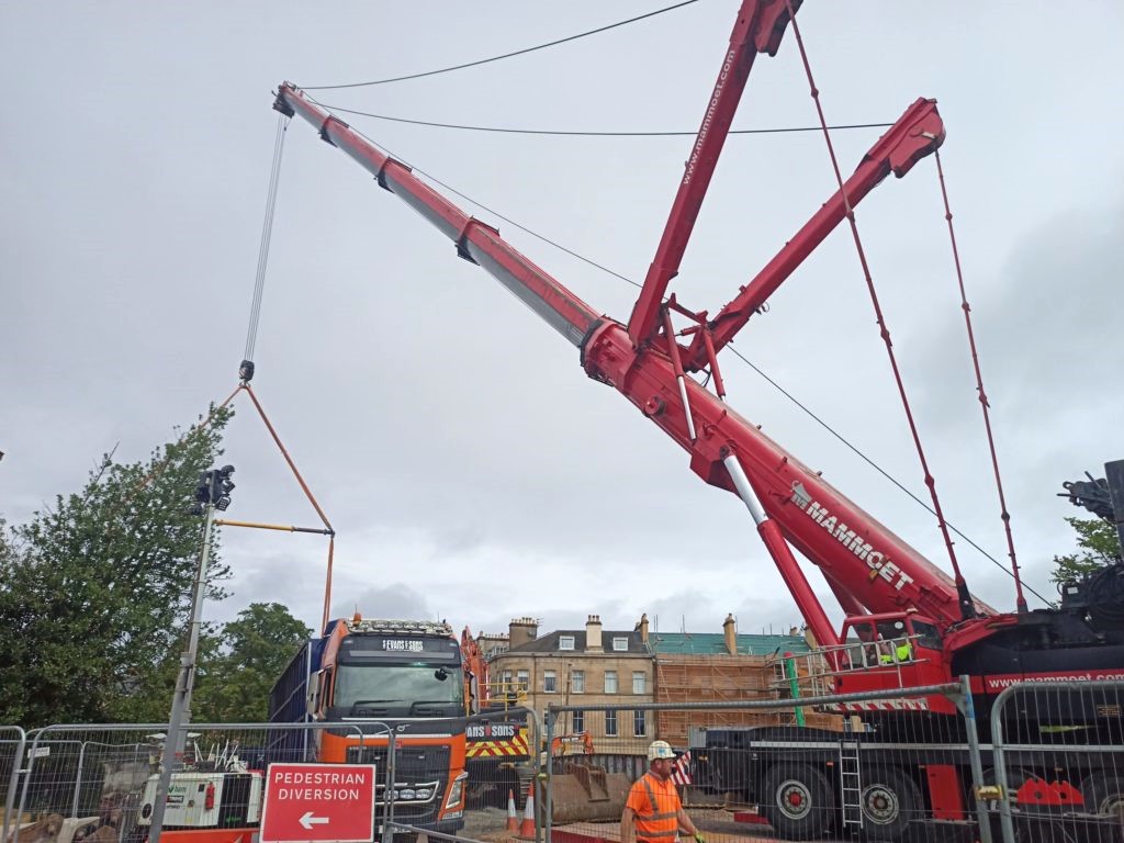 Huge mobile crane extends over the Nithsdale Road bridge deck