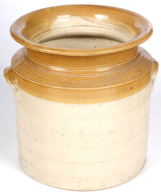 Large cylindrical jar with lipped top, in the classic two-tone brown finish